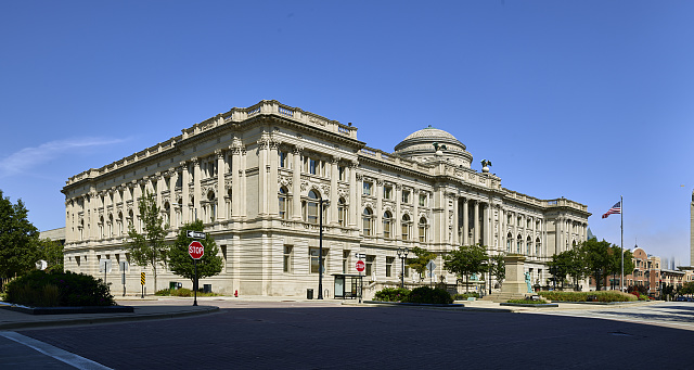 Photograph featuring the Milwaukee Public Library Central Library on Wisconsin Avenue. 