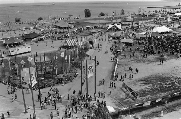 This photograph shows the Summerfest grounds as seen from on top the double Ferris wheel at the midway, taken in 1972. 