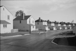 Children play on the street in this 1939 photograph of Greendale houses. 