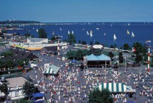 Photograph of crowds at Summerfest and sailboats on Lake Michigan, taken in 1982.