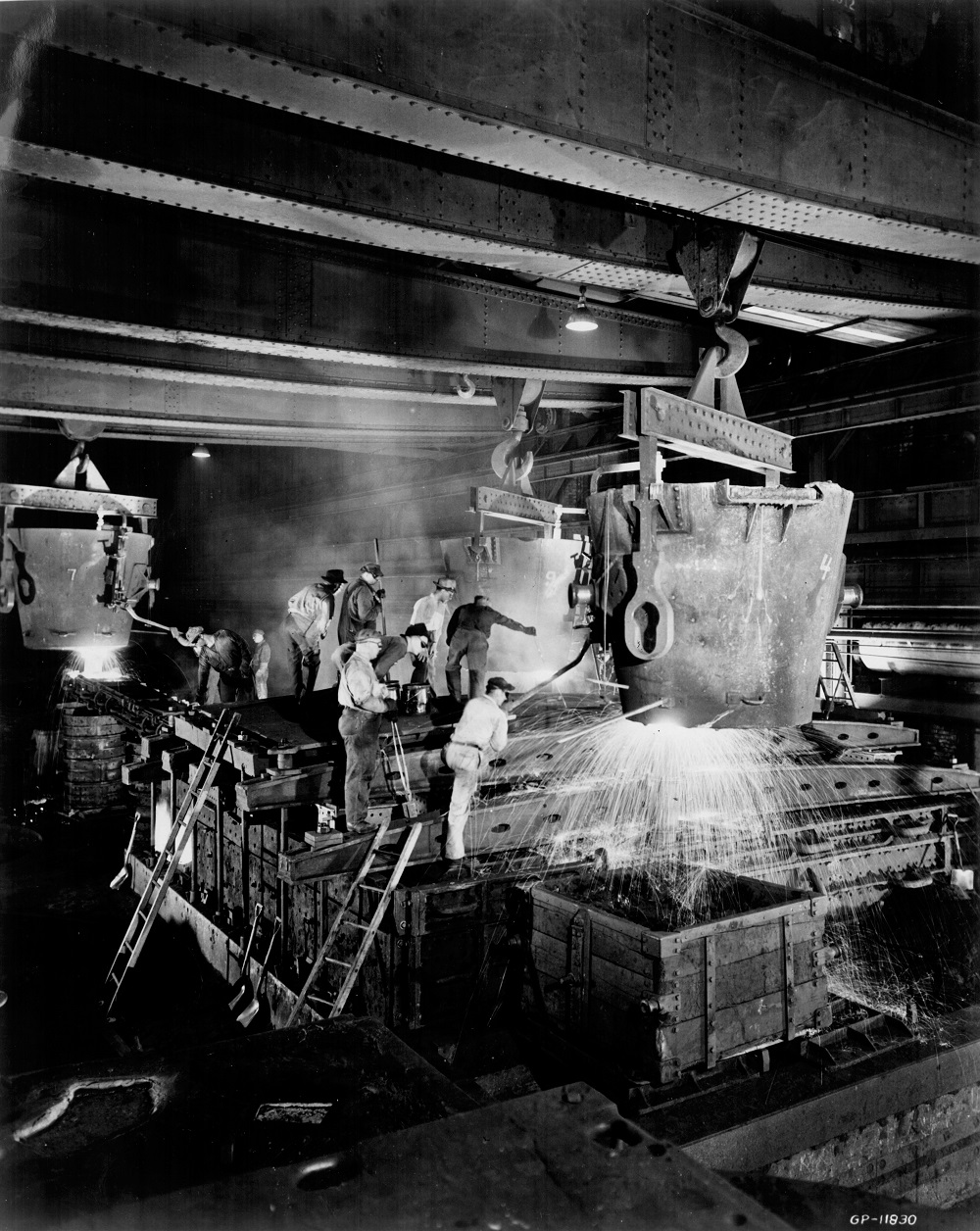 Employees work with molten metal at Falk Corporation in 1963. 