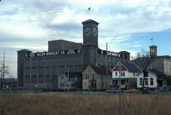 The Allen-Bradley Company building towers behind a row of residential homes in this 1974 photograph. Today the company is part of Rockwell Automation. 