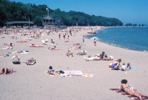 Milwaukee county residents enjoy summer sunshine and sand on Lake Michigan’s shoreline in 1985.