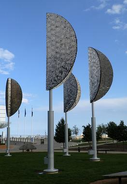 Photograph of the sculpture by Ned Kahn titled "Wind Leaves." This artwork is located in front of Discovery World on Milwaukee's lakefront.