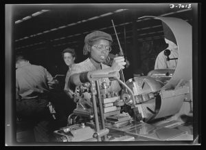 A 20-year-old woman named Annie Tabor works in a Milwaukee supercharger plant in 1942. Superchargers were commonly used in aircraft engines during World War II.