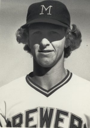 Sepia-colored headshot of Robin Yount from the chest up in a Milwaukee Brewers' jersey and hat. He smiles and makes eye contact with the camera lens.