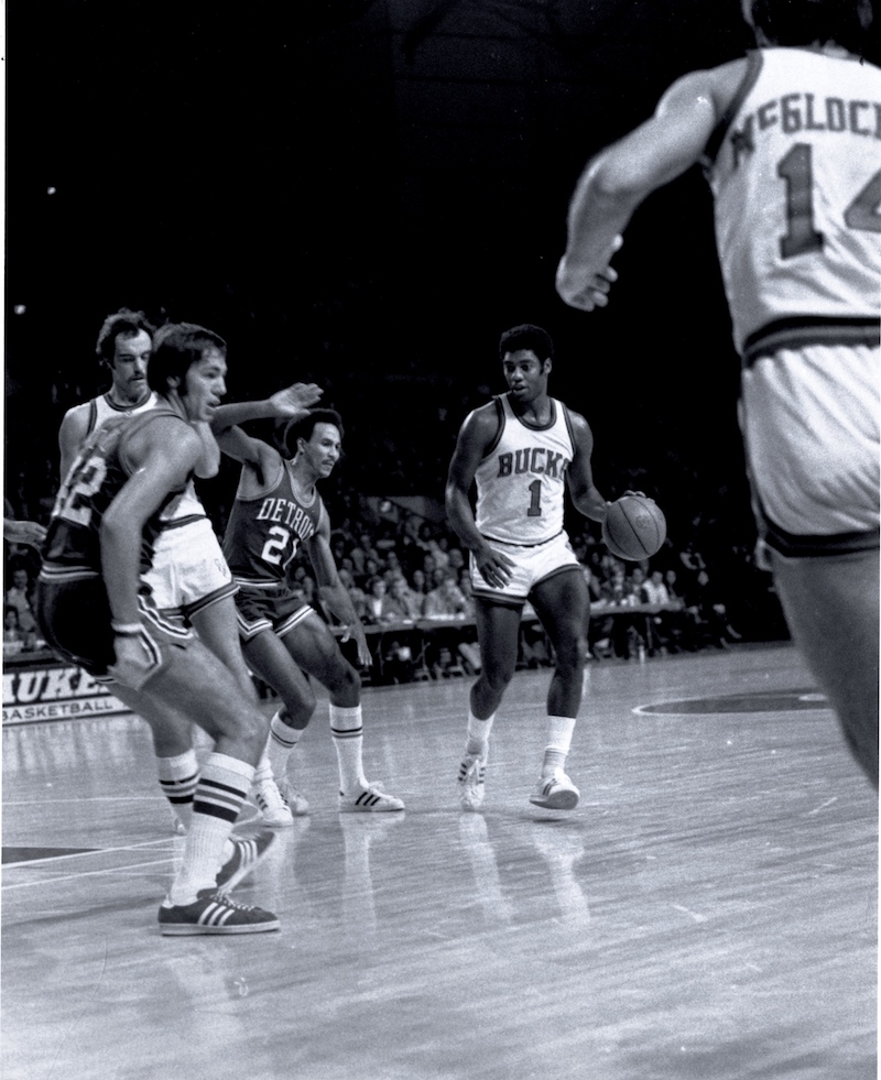 Oscar Robertson, star Bucks point card from 1970-1974, dribbles the ball against the Detroit Pistons.