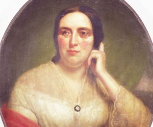 Painted portrait of Mary Blanchard Lynde in glasses and red shawl sitting with eyes glancing to left. Her head leans on her left hand that rests on top of a book placed on a red-colored surface.