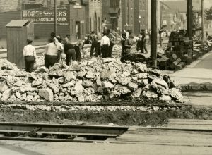 Men working on building the road at North 7th Street and West Wells in this 1913 photograph.