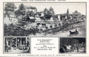 Grayscale postcard illustrating Jacob Nunnemacher's distillery in three images. The dominating drawing on the upper portion of this postcard denotes a farm area. The image on the bottom left shows the distillery, and the bottom right displays rows of cows.