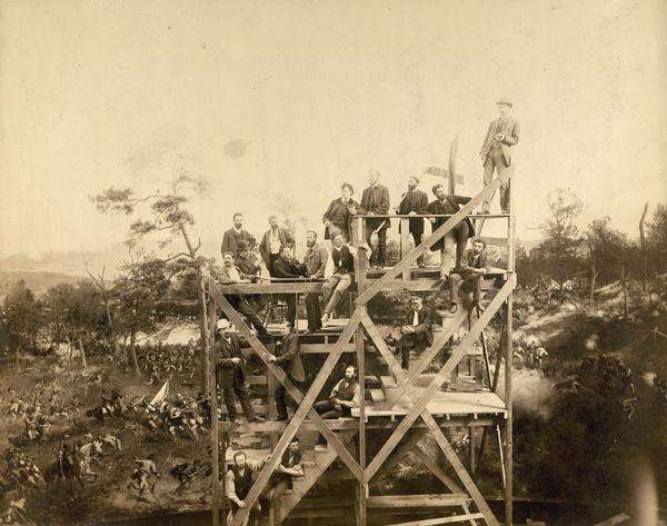 With the Atlanta Cyclorama behind them, a group of German panorama artists stand on scaffolding in their Milwaukee studio in 1886.