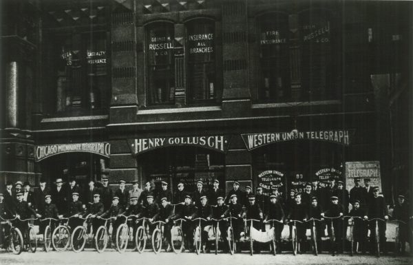 As telecommunications networks developed, they depended less and less on humans to complete the system. This 1909 photograph shows bicycle-riding messengers who delivered telegrams to their final destinations.