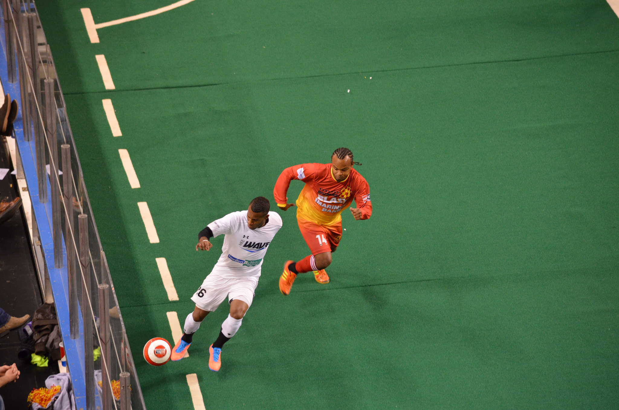 Milwaukee Wave forward Ian Bennett dribbles the ball away from an opponent from the Baltimore Blast in 2013.