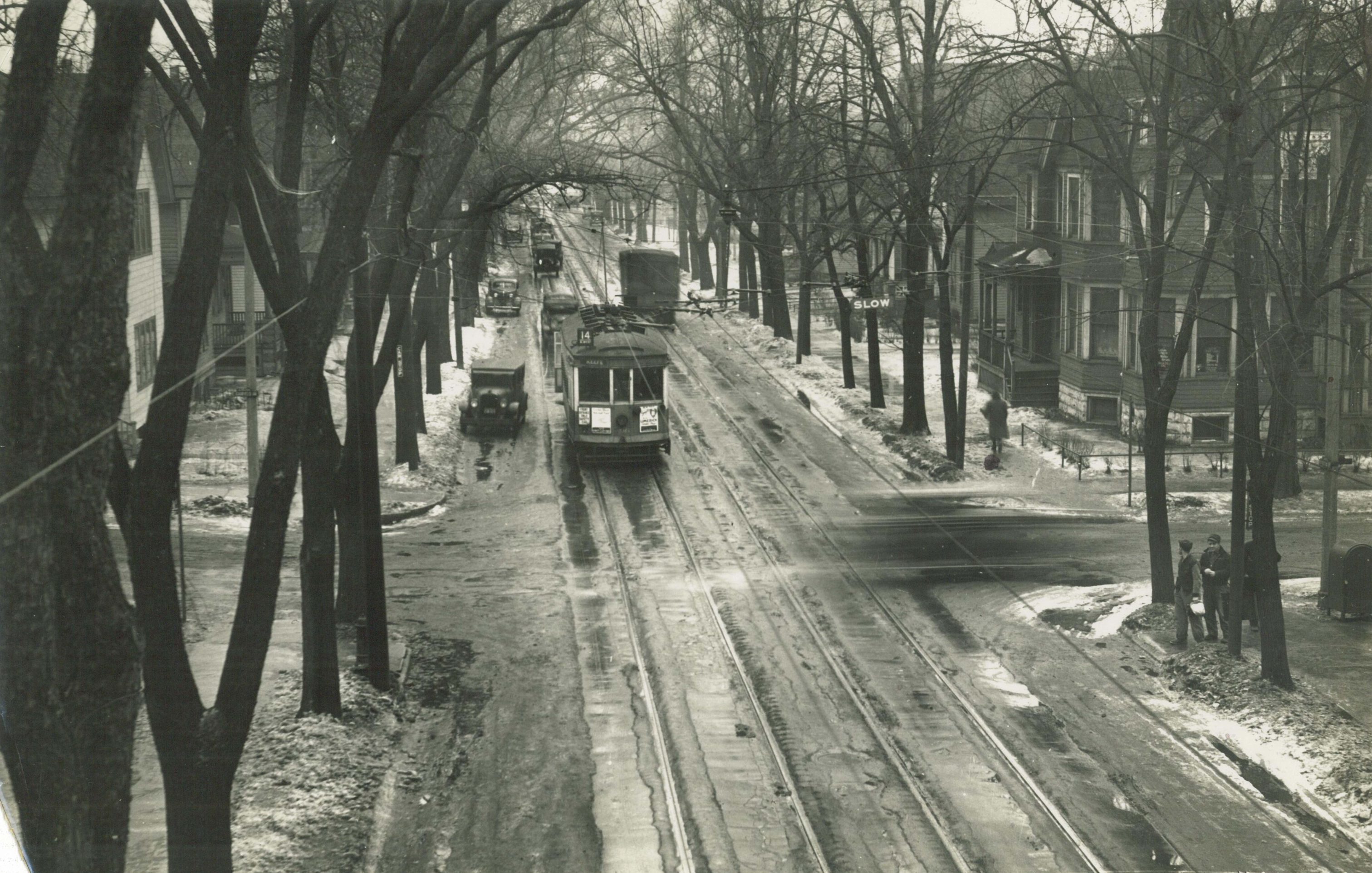 An electric streetcar heads north on Holton Street near E. Garfield Avenue in the early half of the twentieth century.
