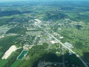 This aerial view of Kewaskum illustrates both the community's recent urban growth and its continued commitment to preserve rural landscapes. 
