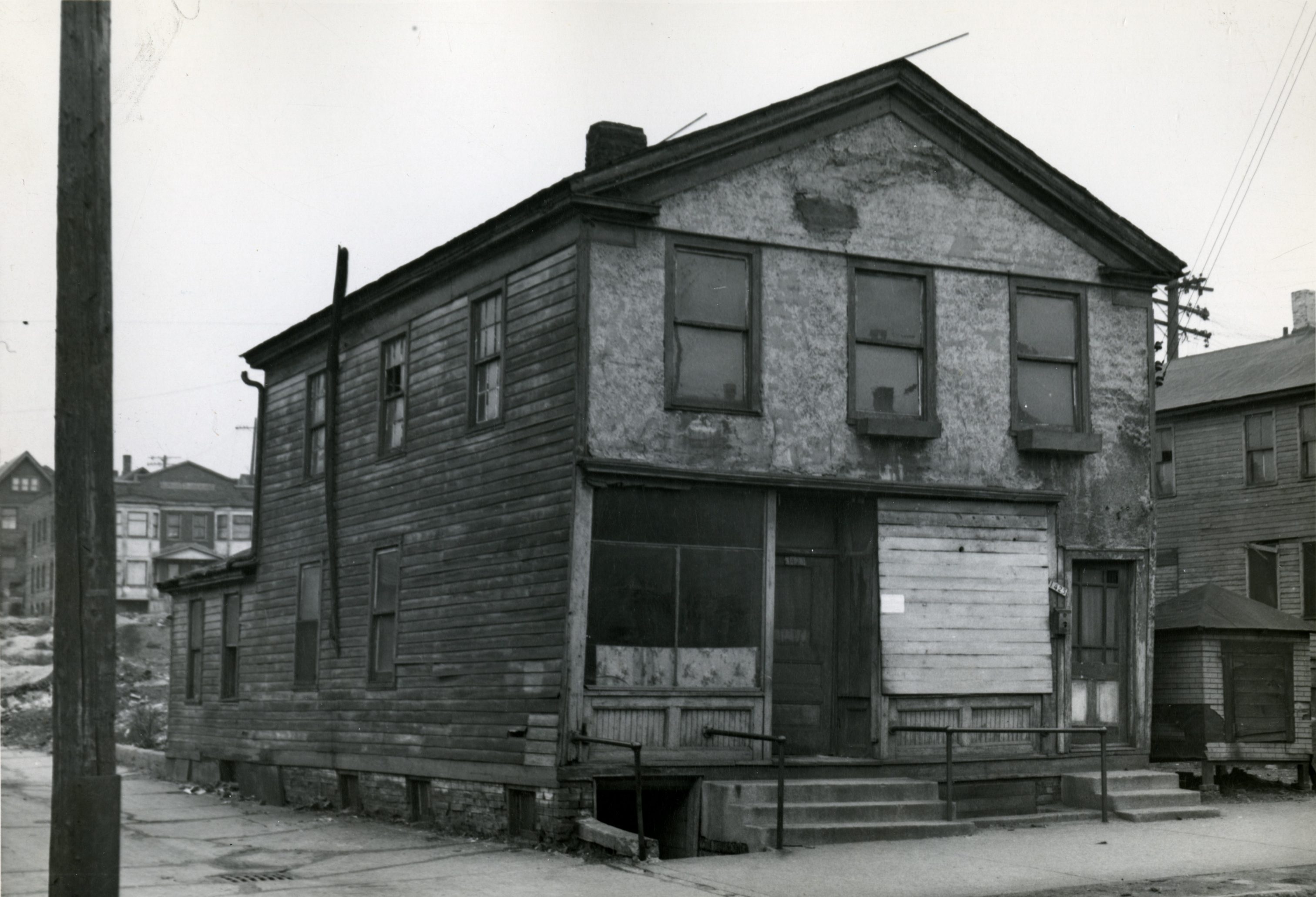 Building regulations, such as housing codes, categorized and quantified physical characteristics of structures in Milwaukee. This building, from the 1400 block of North 6th Street, was in such poor condition that it was razed soon after this photograph was taken in 1947.