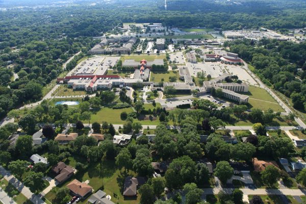 Aerial shot of Cardinal Stritch University. The photograph shows the university's buildings complex and its surrounding areas filled with green trees.
