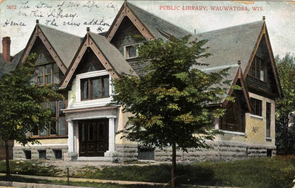 A painted postcard features the Wauwatosa Public Library with two green trees hiding a portion of its facade. The library's entrance appears in the drawing with a portico supported by two white columns. Next to it is a one-and-a-half-story section filled with windows. The multiple-story building has gable roofs.