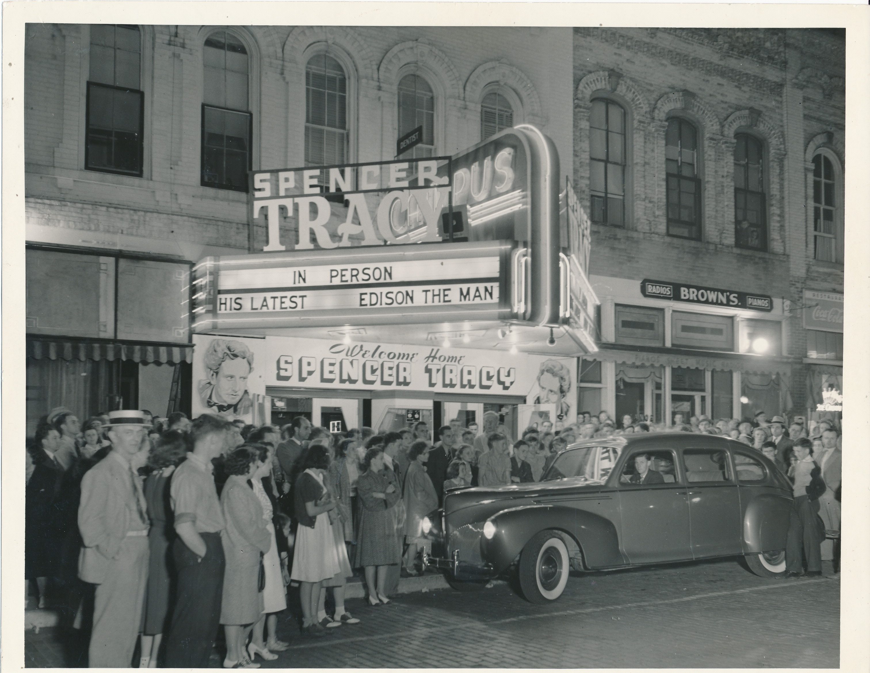 A crowd of people gather outside the movie theater in Ripon, Wisconsin to welcome home Milwaukee native and Ripon College alumnus Spencer Tracy in celebration of his 1940 movie "Edison the Man."
