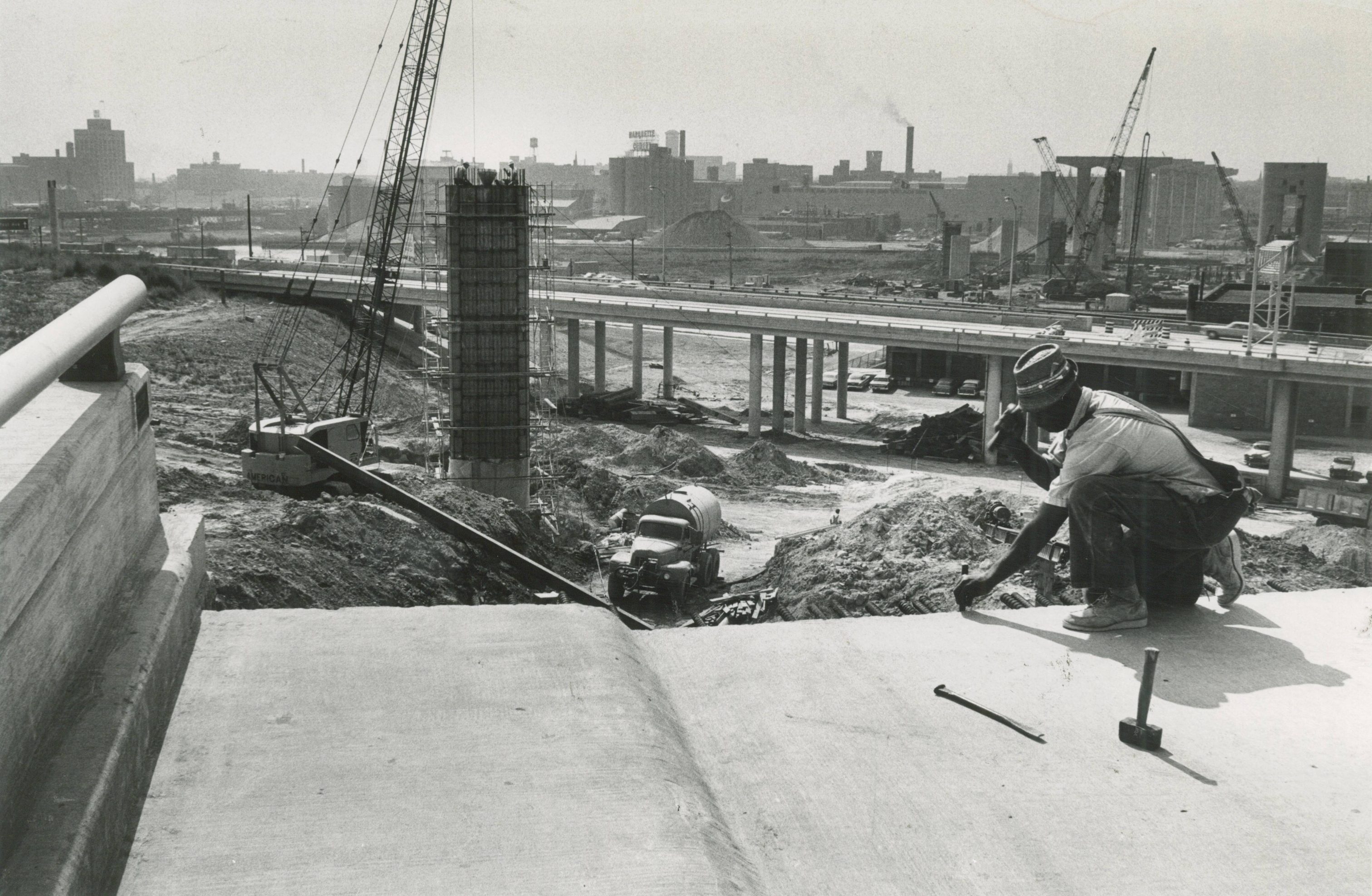 A man works on the original Marquette Interchange in 1966. During planning and initial construction, the project was known as the Central Interchange.