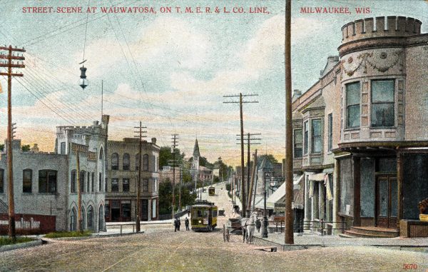 A painted postcard showcases a Wauwatosa street stretching down with the TMER&L Company interurban line in the middle. The streetcars in yellow are in the distance. Buildings and utility poles appear on either side of the street as far as the eye can see. Overhead wires are visible. Text at the top reads, "Street Scene at Wauwatosa on T.M.E.R & L. CO. Line, Milwaukee, Wis."