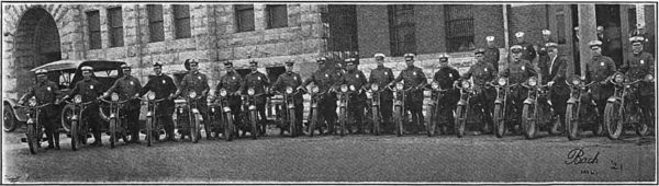 Officers of the Milwaukee Police Department's motorcycle squad pose for a photograph around 1921. 