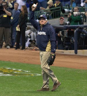 Bob Uecker acknowledges the crowd at Miller Park before throwing out the first pitch to start the NL Divisional Series between the Milwaukee Brewers and the Arizona Diamondbacks in 2011. 