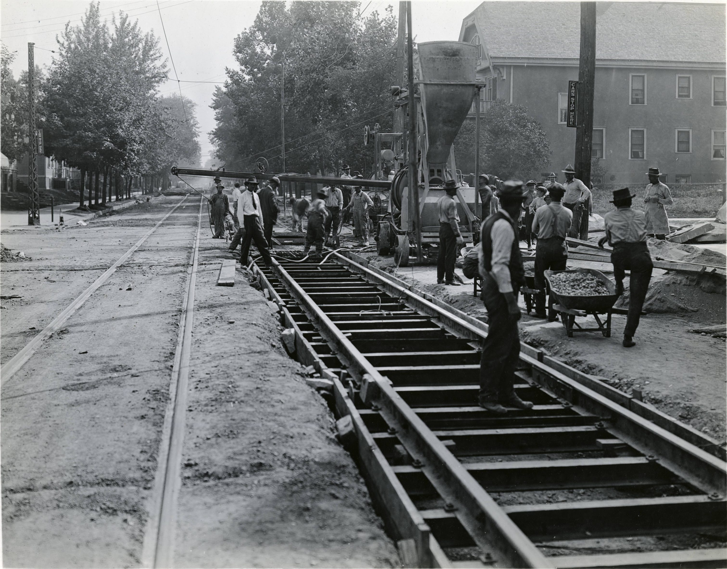 A group of men work to lay streetcar tracks along N. 8th Street in 1919. 
