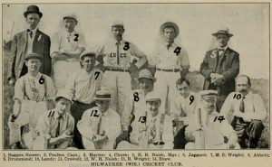 A clipping contains the Milwaukee Cricket Club group photo in sepia. The fourteen members pose outside in three rows. Two people on the left in the front row carry cricket balls, and two on the right hold cricket bats. Numbers are written on the image. Men in the back row are numbered from one to five. The second row is from six to ten, the first row is from eleven to fourteen. Names of all members are listed at the bottom portion of the clipping based on the numbers.