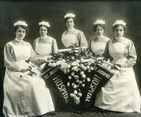 Five recent graduates of the St. Joseph's Hospital nursing program pose with their degrees in 1915. 