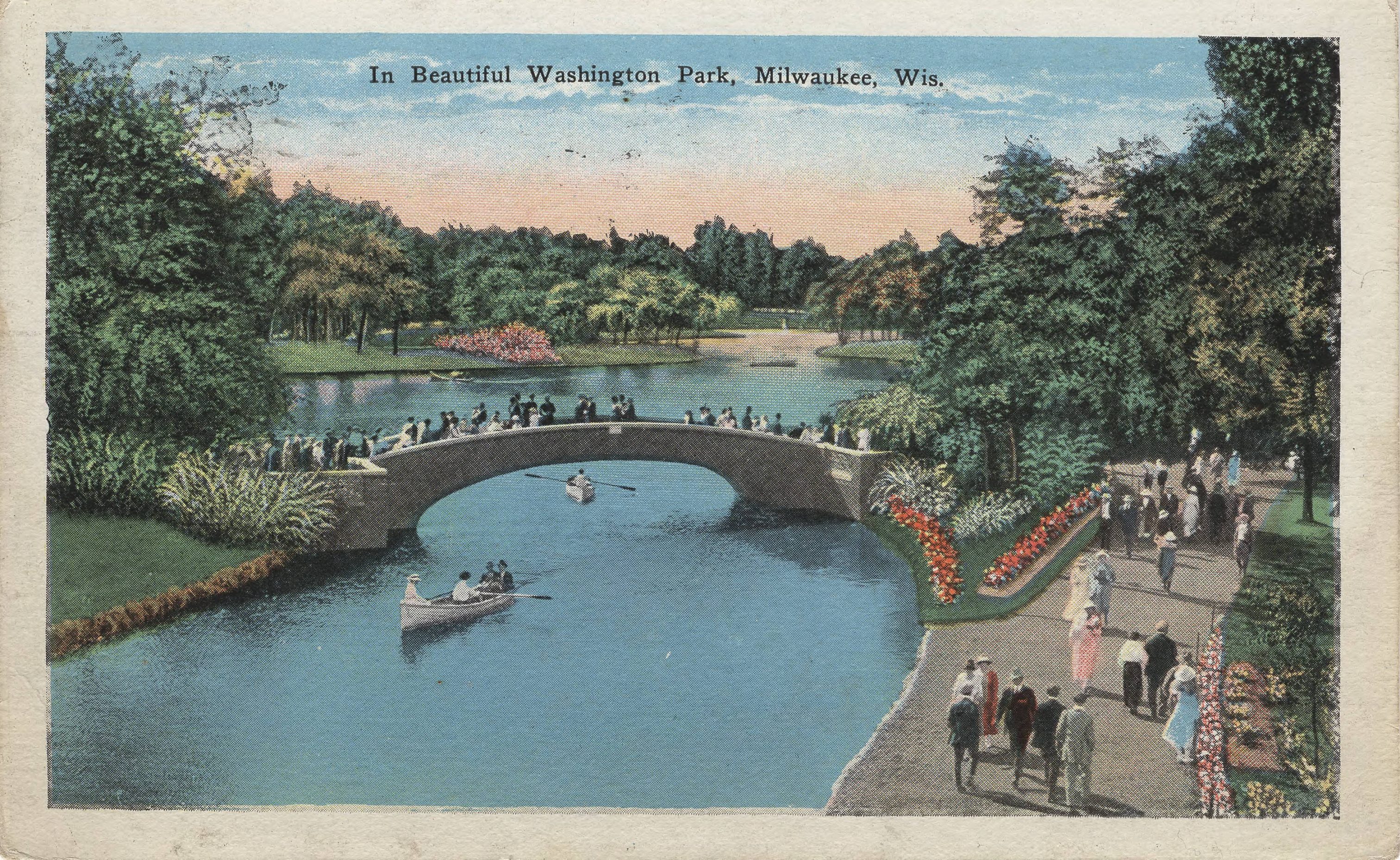 This 1929 post card illustrates groups of people enjoying the gardens and artificial lake of Washington Park.
