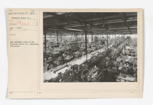 The assembly room of the Waukesha Motor Company, pictured here in April 1918, is filled with employees and partially-completed engines. 
