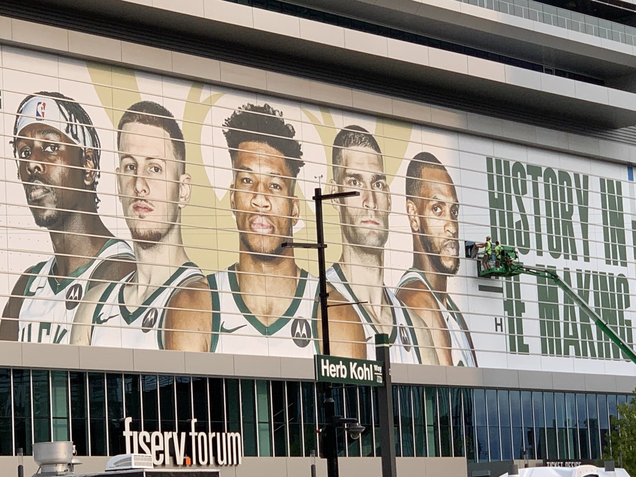 A work crew at the Fiserv Forum updating the "History in the Making Sign" the morning after the Milwaukee Bucks won the 2021 National Basketball Association championship for the first time in 50 years.